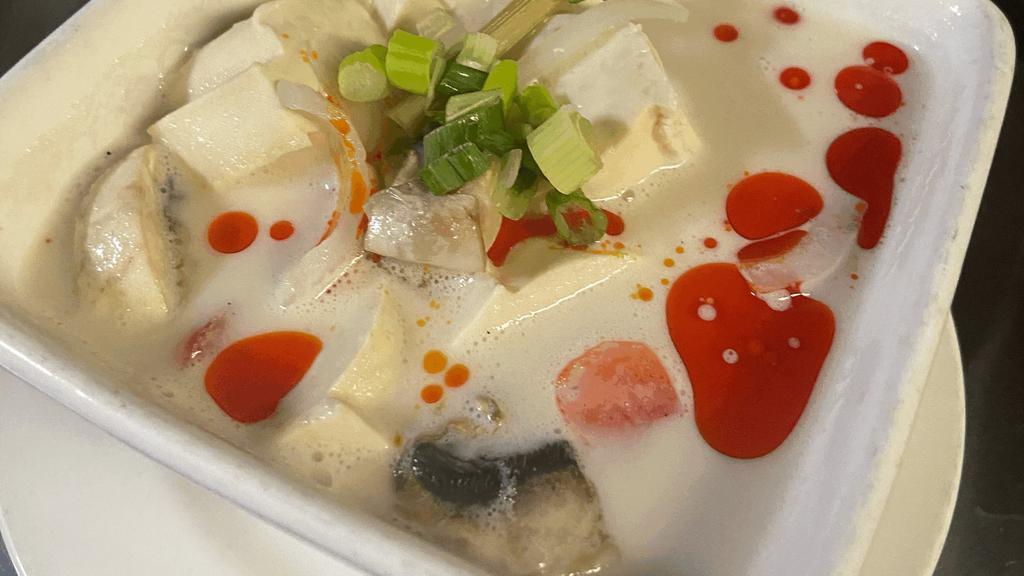Tom Kha Soup (Galangal Soup) · Coconut milk soup with galangal broth, mushrooms, and onions.
