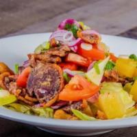 Duck Salad · Crispy roasted duck, onion, tomato, pineapple, cashew nut, roasted chili, and lime dressing ...