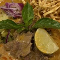 Khao Soi Beef · Northern style special curry served with egg noodle, red onions, pickled mustard, fried shal...