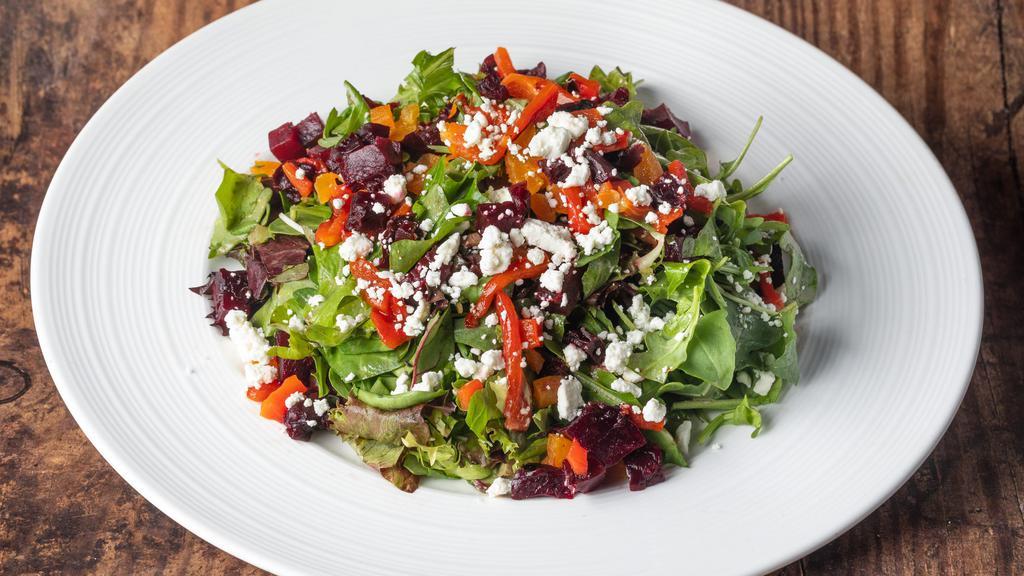 Beet And Goat Cheese Salad · Mesclun greens, baby arugula, diced beets, dried apricots,. roasted peppers, crumbled goat cheese, and drizzled with. balsamic vinaigrette.