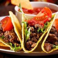 Grilled Steak Soft Taco · Soft shell taco. A eight inch soft flour tortilla buffed with lettuce, tomatoes, and cheddar...