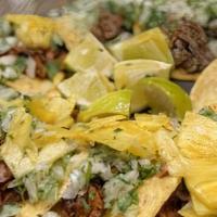 Al Pastor Nachos · Melty nachos loaded with al pastor, melted cheese, pico de gallo, and your choice of additio...