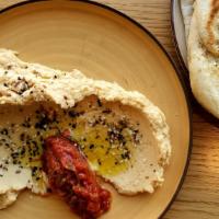 Matbucha Hummus · matbucha / everything spice / 2 za'atar flatbreads