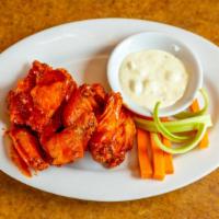 Wings · Spicy buffalo, sticky honey asian or our homemade pineapple bbq.