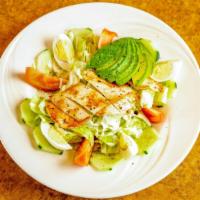 Grilled Chicken Cobb Salad · Fresh romaine lettuce hard boiled eggs, avocado, grilled chicken, slab bacon, blue cheese, t...