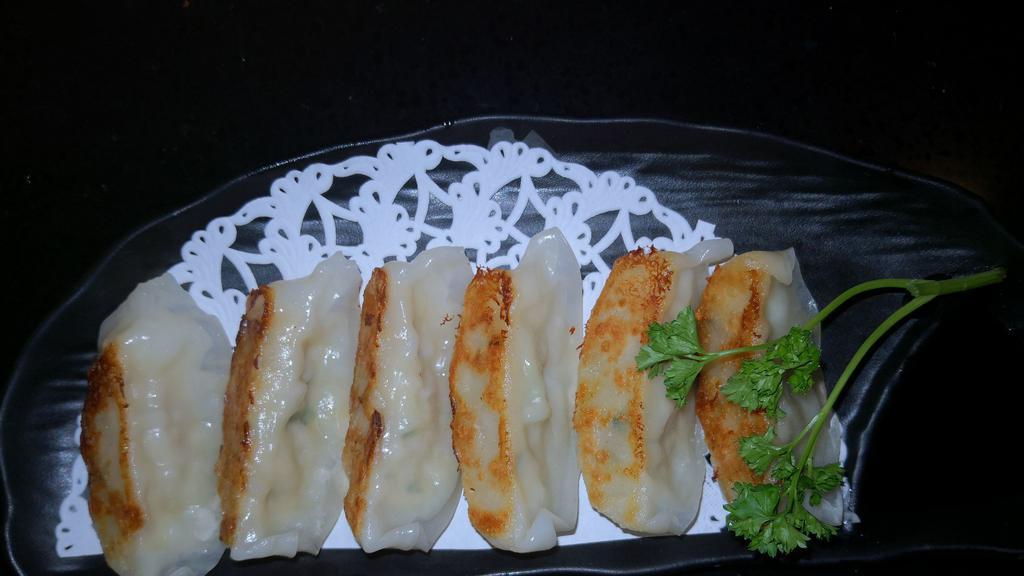 Gyoza Pan-Fried Dumpling · Choice of Pork, Beef,  or Vegetables.