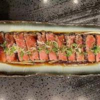Pepper Tuna Appetizer · Seared pepper tuna with wasabi yuzu sauce.