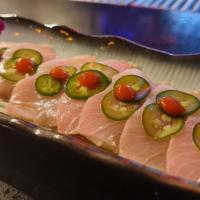 Yellowtail Jalapeños Appetizer · Sliced yellowtail with jalapeños and chef’s special sauce.