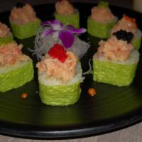 Fusion Roll--Cooked · 8pcs Shrimp, Kani, cucumber, mango wrap with soy paper, and lobster salad on the top with 4 ...
