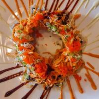Volcano Roll--Cooked · 8pcs. Deep fried lightly battered, tuna, cream cheese, jalapeno inside, Topped with spicy kani