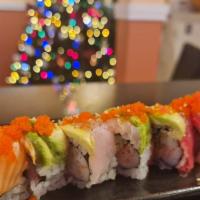 Rainbow Roll · 8pcs.Crab, cucumber, and smelt roe topped with assorted fish and avocado.