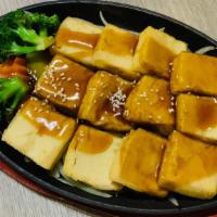 Tofu Teriyaki · Broiled tofu with sweet teriyaki sauce.