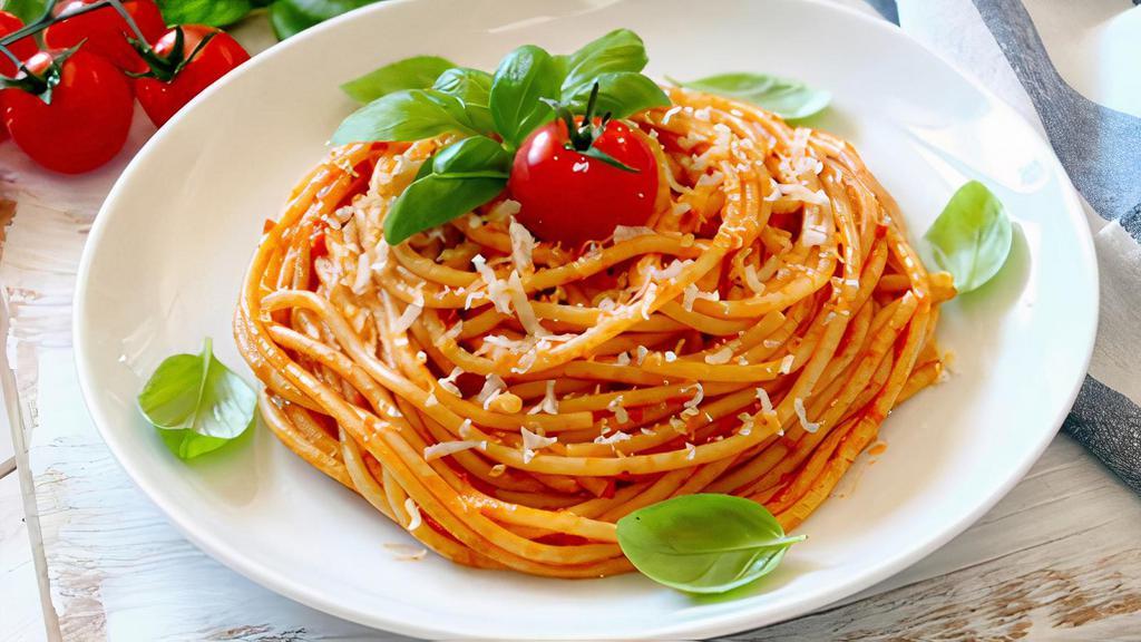 Tomato Sauce Spaghetti · Spaghetti style pasta beaded with warm tomato sauce.