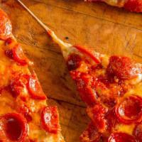 The Extra Roni · (Peparoni Pizza)Fresh sliced pepperoni, our stewed tomato based
homemade marinara sauce, fre...