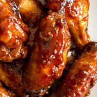 Bbq Wings · Traditional bone-in wings, hand-tossed in your choice of sauce or rub. Choose your flavors!