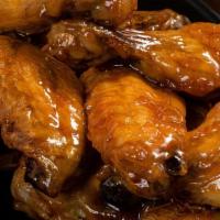 Honey Garlic Wings · Traditional bone-in wings, hand-tossed in your choice of sauce or rub. Choose your flavors!