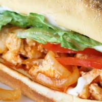 Sweet Chile Chicken Parmesan Hero · A long sandwich on a roll.