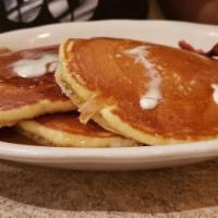 Golden Brown Pancakes · Served with warm syrup and butter.