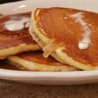 Golden Brown Pancakes · Served with warm syrup and butter.