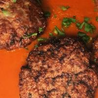Polpettine · Pan seared veal and beef meatballs, house tomato sauce.