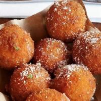 Arancini · Lightly fried four cheese risotto balls.