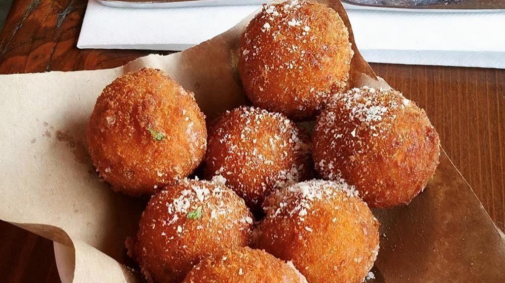 Arancini · Lightly fried four cheese risotto balls.
