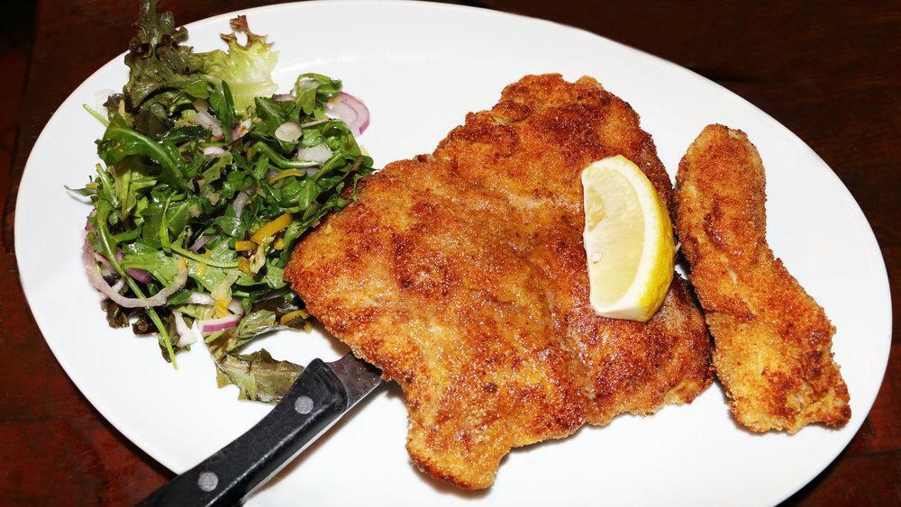 Pollo Alla Milanese · Lighlty breaded pan roasted chicken breast served with a mixed green salad