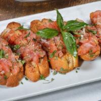Bruschetta (5) · Toasted italian bread topped with chopped tomato, onion and cheese.