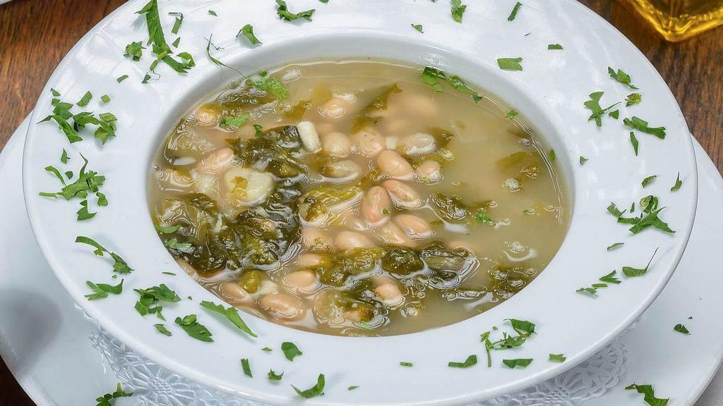 Escarole And Bean Soup · Sauteed escarole and cannellini beans in a light broth with garlic and olive oil.