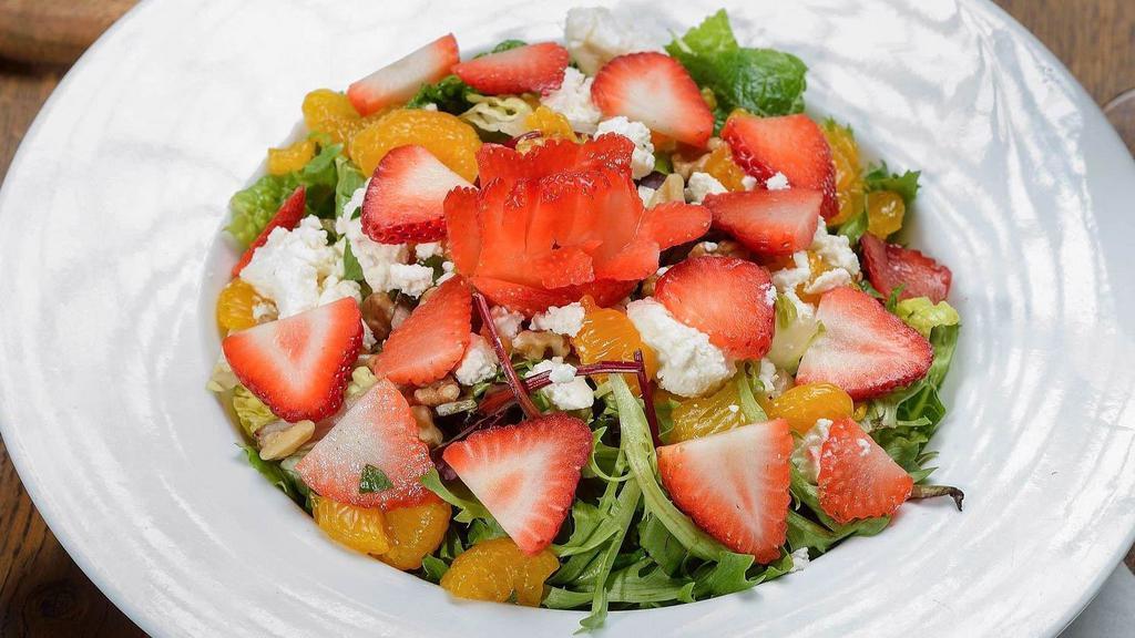 Strawberry Mandarin Salad · Strawberry, feta cheese, walnuts, mandarin oranges and mixed greens with raspberry vinaigrette.