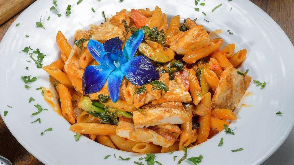 Penne Primavera & Chicken · Mixed vegetables and chicken in a light pink sauce.