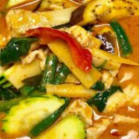 (L)Red Curry · Served with Jasmine Rice. Coconut milk, bamboo, red pepper, eggplant and basil.