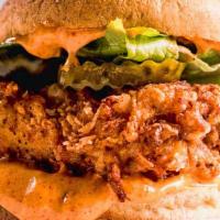 Crispy Chicken Sandwich · Organic chicken breast Battered & fried, arugula, pickles, chipotle aioli.