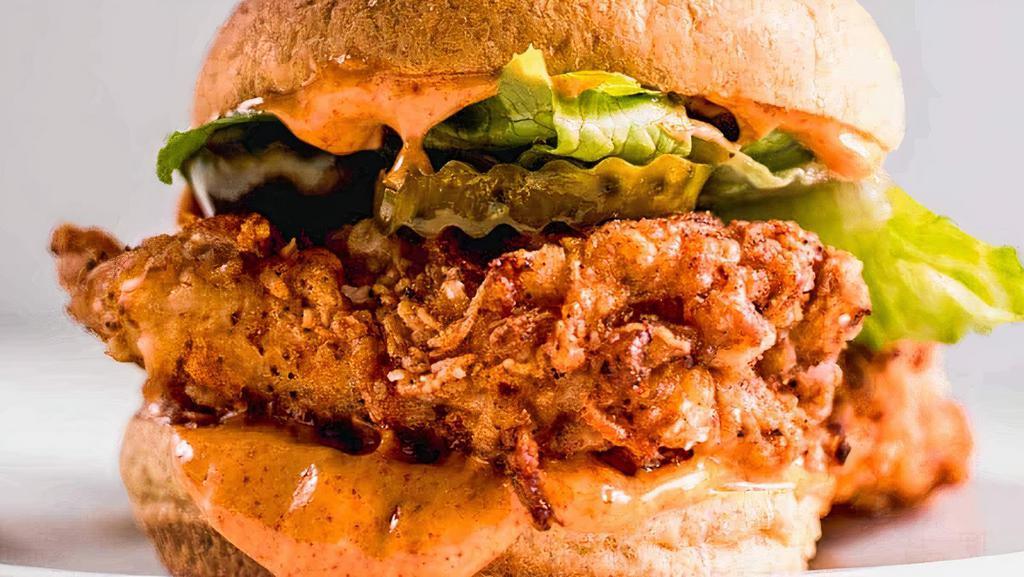 Crispy Chicken Sandwich · Organic chicken breast Battered & fried, arugula, pickles, chipotle aioli.