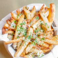 Truffle Fries · Tossed in 5 months aged grated parmesan cheese, parsley, black truffle oil drizzle.