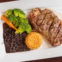 New York Steak · Served with vegetables and rice.