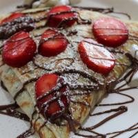 Nutella With Fresh Strawberries · Nutella inside, plenty of fresh strawberries, Nutella drizzled on top then a dusting of powd...