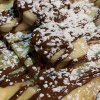 Nutella With Fresh Bananas · Nutella inside, plenty of fresh banana, Nutella drizzled on top then a dusting of powdered s...