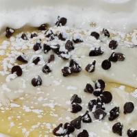 Cannoli Cream · Cannoli cream (no pistachio nuts), contains a few chocolate chips, with a dusting of powdere...