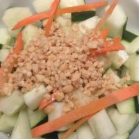 Cucumber Salad · Cucumber, carrots topped w. Thai sweet & sour dressing & ground peanuts.