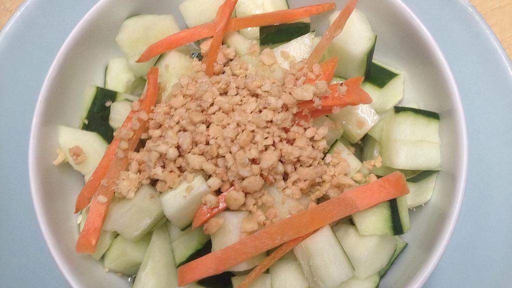 Cucumber Salad · Cucumber, carrots topped w. Thai sweet & sour dressing & ground peanuts.