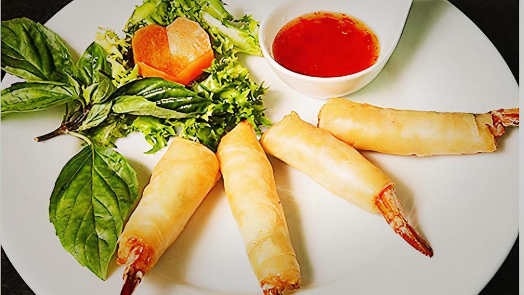 Shrimp Mermaid · Deep fried marinated whole shrimps wrapped w. egg roll skin served w. sweet chili sauce.
