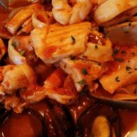 Linguini Lido · Pasta with shrimp, clams, mussels, calamari, fresh fish, and scallops, weed in a delicate re...