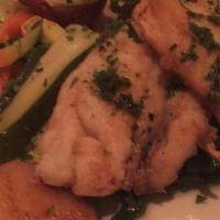 Branzino · Pan seared Mediterranean sea bass fillet served over sautéed spinach drizzled with cold extr...