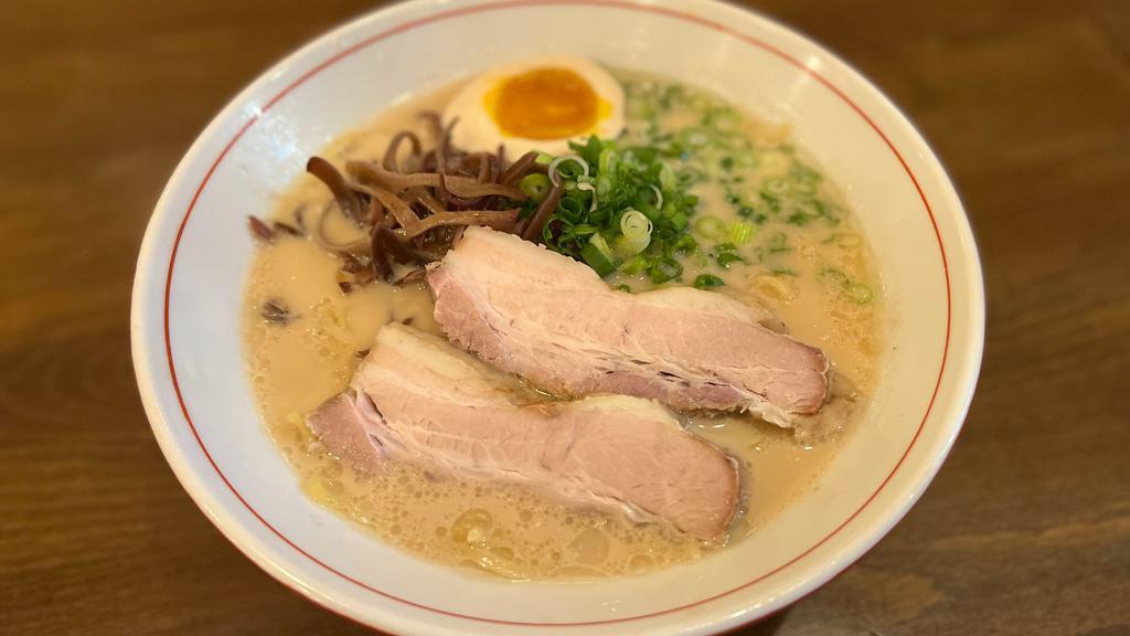 Shoyu Pork Ramen · Wavy, thick egg noodles in a soy sauce-based 