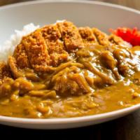 Pork Cutlet Curry · Crispy breaded pork loin on the rice covered creamy curry.