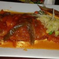 Brown Stewed Snapper · Served with plantains your choice of rice and your choice of steamed vegetables or garden sa...