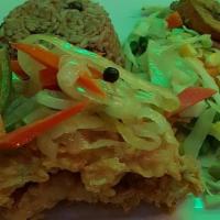 Escoveitched Whiting Fish · Battered and fried, served with spicy onions and carrots.