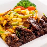 Oxtail Reggae Pasta · Pasta marinated in homemade alfredo sauce onions carrots green peppers and island cz spice. ...
