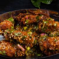 Chicken Wings · Crispy Thai style chicken wings country sauce.